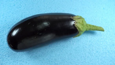 Raw eggplant rotates in 4K Stock Footage 141322880
