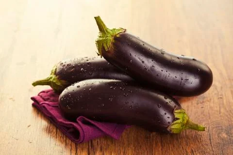 Raw eggplants Stock Photos