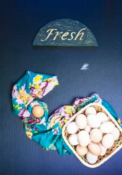 Raw eggs on the blue background Stock Photos