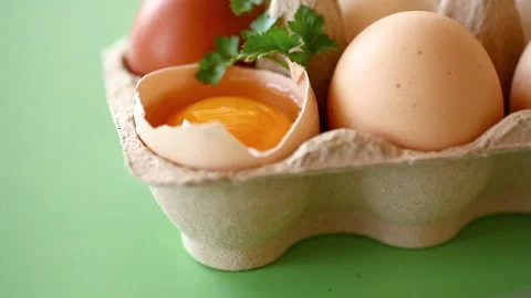 Raw eggs in carton with baking tools and herbs composition Stock Footage 335523688