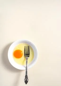 Raw eggs. Close up. flat lay raw eggs yolk in bowl. Isolated broken white b.. Stock Photos