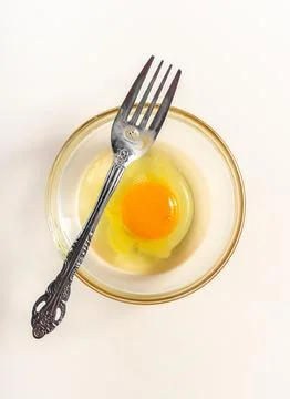 Raw eggs. Close up. flat lay raw eggs yolk in bowl. Isolated broken white b.. Stock Photos