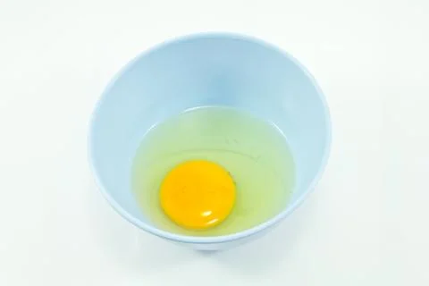 Raw eggs in a cup Stock Photos