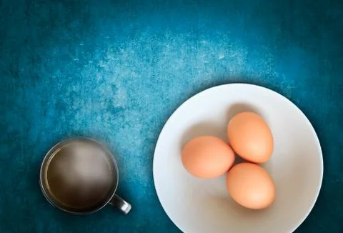 Raw eggs with hot chocolate Stock Photos