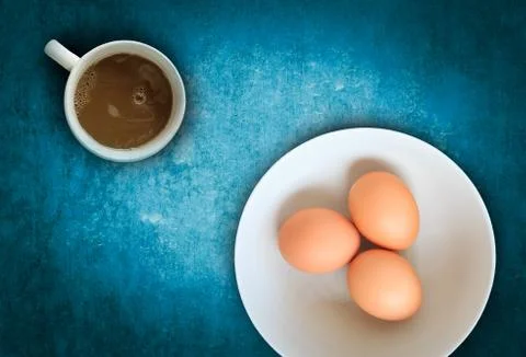 Raw eggs with hot chocolate  Stock Photos