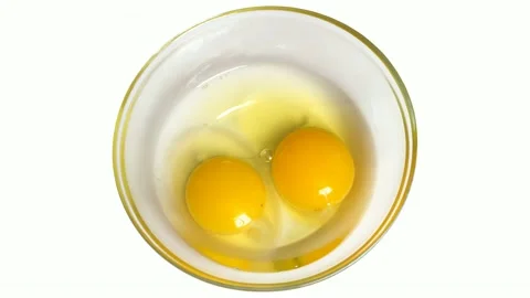 Raw eggs in a plate Stock Footage 142555409