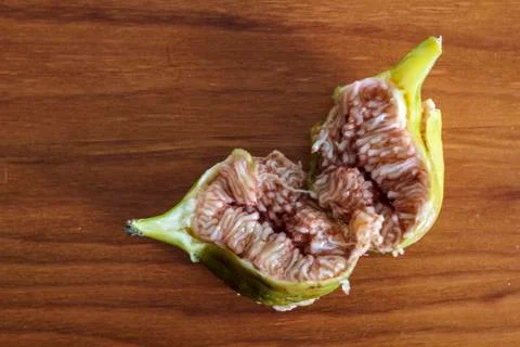 Raw fig fruit opened on wooden table Stock Photos