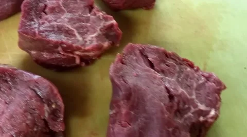 Raw filet mignon beef steaks, on a cutting board Stock Footage 54799833