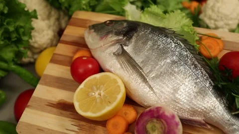 Raw Fish And Fresh Vegetables Rotating Slowly Видео 343741700