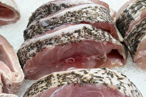Raw fish body cuts representing seafood preparation, fishmongery and market.. Stockfoto's