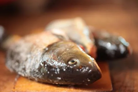 Raw fish on a cutting Board Stock Photos