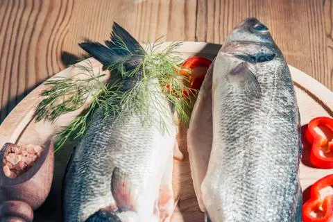 Raw fish on a cutting Board Stock Photos