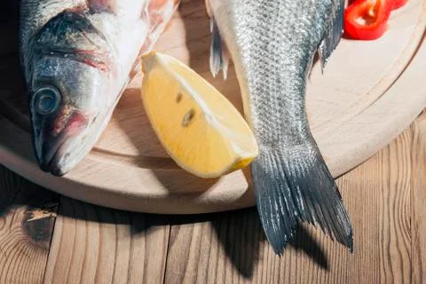 Raw fish on a cutting Board Stock Photos
