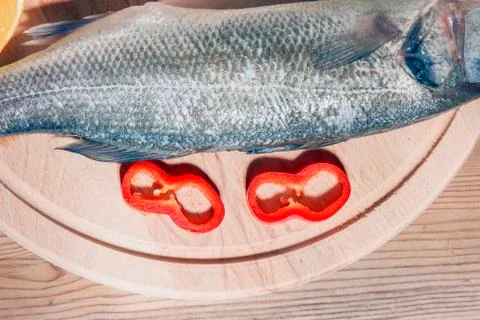 Raw fish on a cutting Board Stock Photos