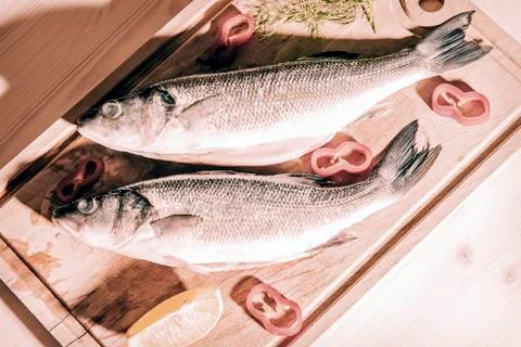 Raw fish on a cutting Board Stock Photos