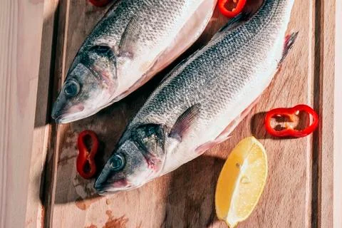 Raw fish on a cutting Board Stock Photos