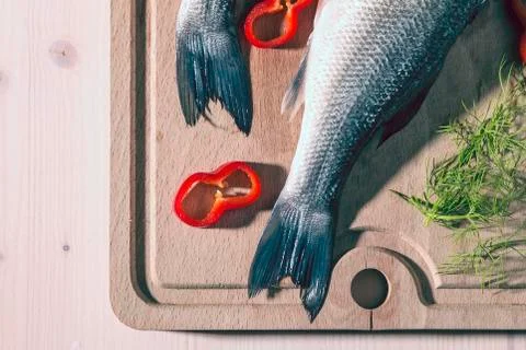 Raw fish on a cutting Board Stock Photos