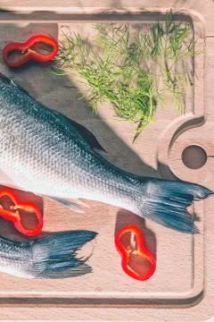 Raw fish on a cutting Board Stock Photos