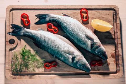 Raw fish on a cutting Board Stock Photos