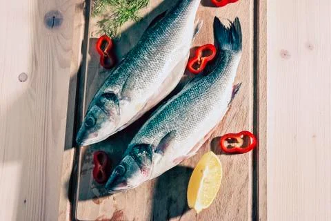 Raw fish on a cutting Board Stock Photos