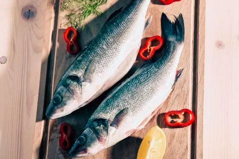 Raw fish on a cutting Board Stock Photos