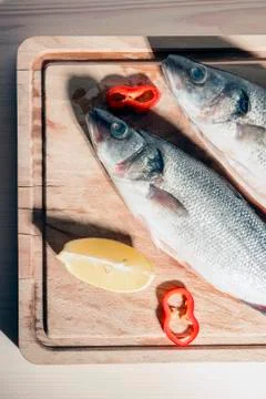 Raw fish on a cutting Board Stock Photos