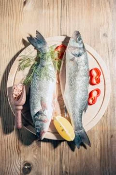 Raw fish on a cutting Board Stock Photos