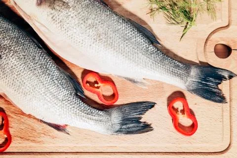 Raw fish on a cutting Board Stock Photos
