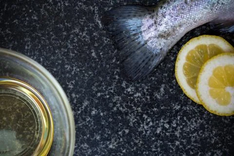 Raw fish on dark background Stock Photos