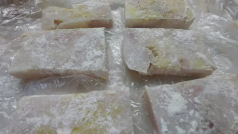 Raw fish fillets breaded in flour prepared for frying Stock Footage 334837707
