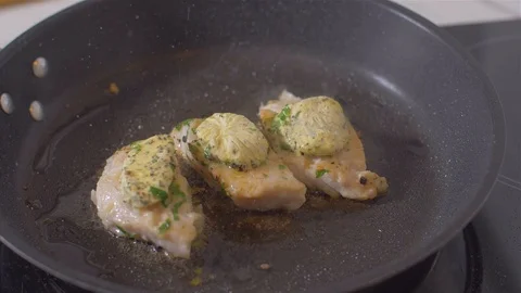 Raw fish fillets fried in a pan with butter Video stock 111968482