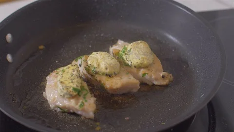 Raw fish fillets fried in a pan with butter Stock Footage 111968690