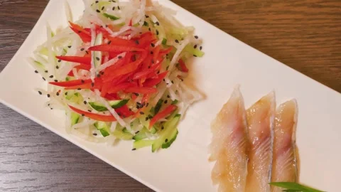 Raw fish with vegetables, a Japanese dish Stock Footage 306151701