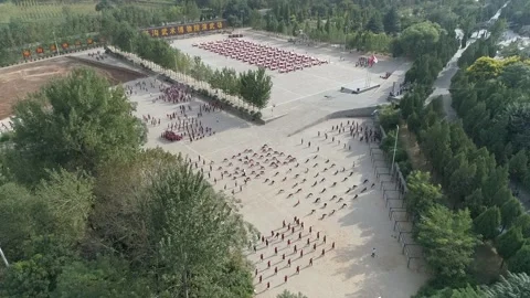 Raw footage of Aerial drone view of Shaolin temple training Martial arts in.. Video stock 346725992