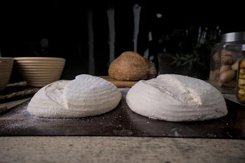 Raw Fresh artisan bread dough ready to bake on a Rustic Wooden Table. Stock Photos