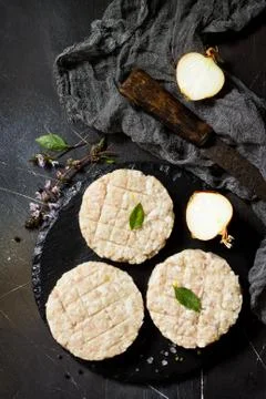 Raw fresh cutlets burger from beef for homemade burgers cooking with spices. Stock Photos