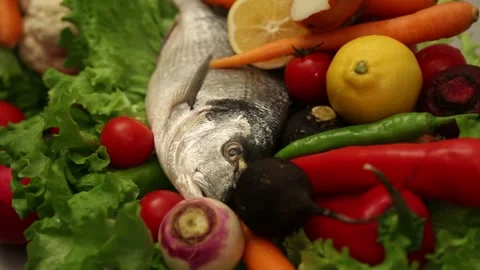 Raw Fresh Fish Surrounded By Colorful Vegetables Stock Footage 343742361