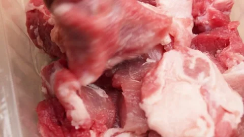 Raw fresh meat close-up. Sliced pieces of cooked pork close-up. Stock Footage 255471233