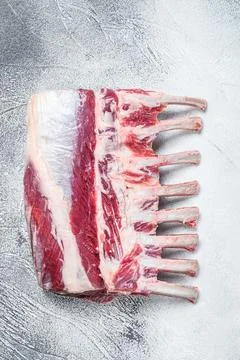 Raw fresh rack of lamb meat. White background. Top view Stock Photos
