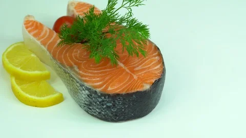 Raw fresh uncooked salmon red fish fillet on white plate Stock Footage 87462165