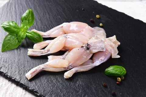 Raw frog legs Stock Photos