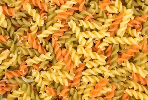 Raw fusilli pasta - three colors Stock Photos