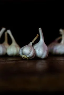 Raw Garlic kept on the table Stock Photos