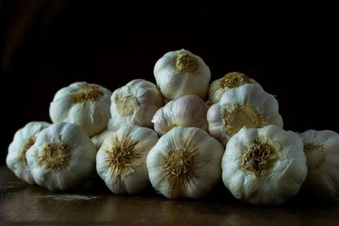 Raw garlic kept on the table Stock Photos