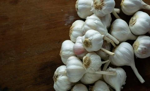 Raw garlic kept on the table Stock Photos