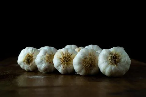 Raw garlic kept on the table Stock Photos