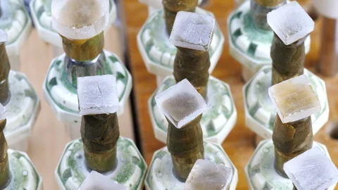 Raw gemstone processing equipment. Gems on the metal dop sticks for a facet on a Stock Footage 101328171