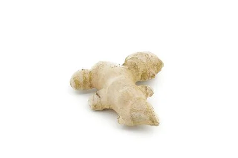 Raw ginger root resting on bright white background. Stock Photos