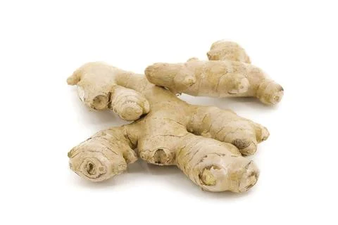 Raw ginger root set on a sharp white background. Stock Photos