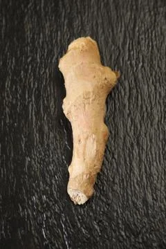 Raw ginger root on slate plate healthy food Stock Photos